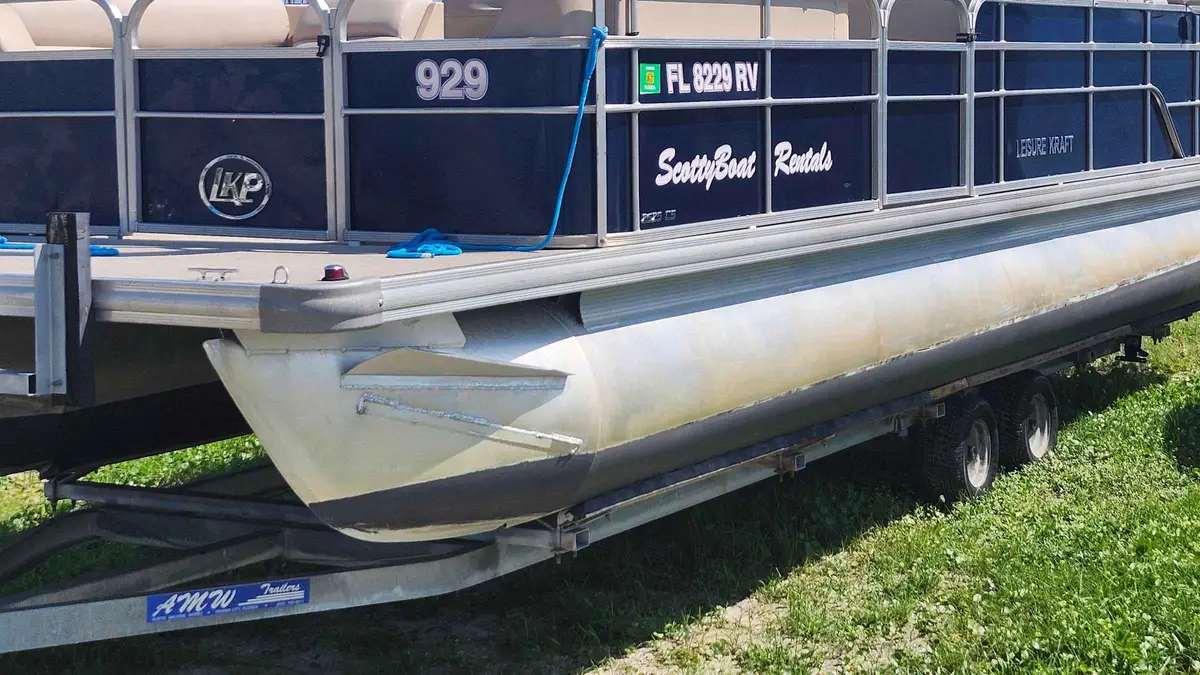 A ScottyBoat Rentals pontoon on its trailer, the boat for a Shell Island pontoon rental from Panama City, Florida