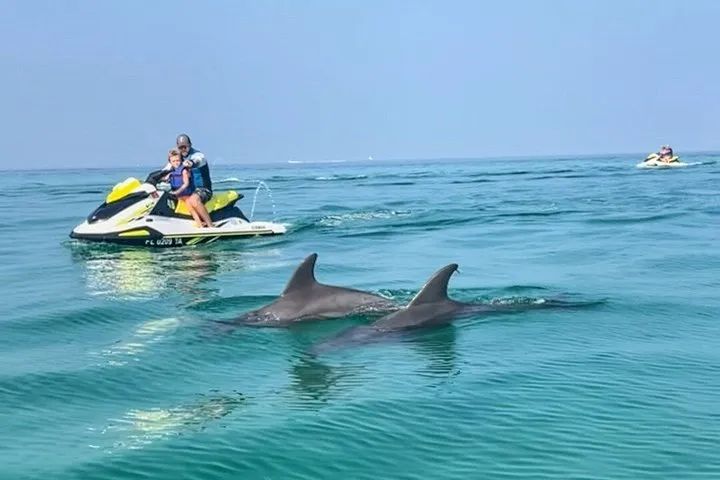 A jet ski on blue-green water on a Shell Island jet ski dolphin tour from Panama City Beach, Florida